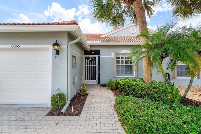 entrance to property featuring a garage