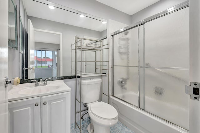 full bathroom with vanity, toilet, tile patterned floors, and shower / bath combination with glass door