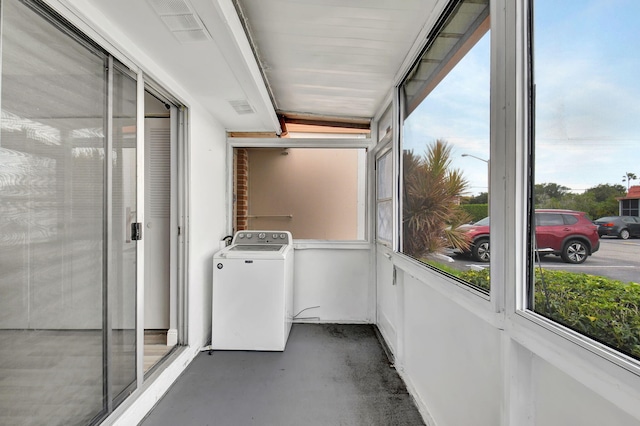 unfurnished sunroom with washer / clothes dryer