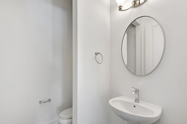 bathroom with sink and toilet