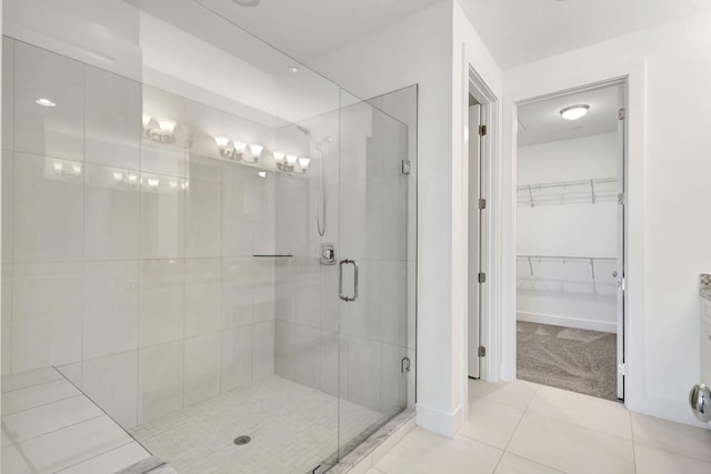 bathroom featuring walk in shower and tile patterned floors