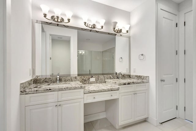 bathroom with dual bowl vanity and tile patterned flooring