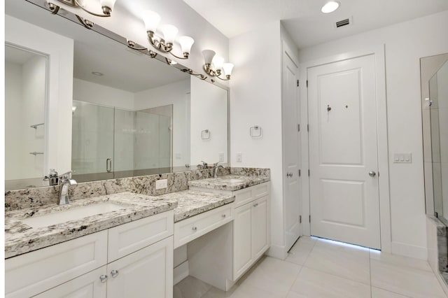 bathroom featuring dual bowl vanity and tile patterned flooring