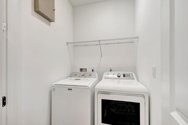 washroom with independent washer and dryer