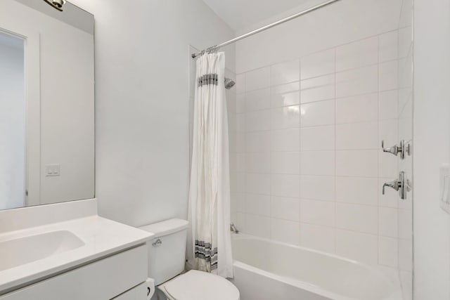 full bathroom featuring shower / tub combo with curtain, vanity, and toilet