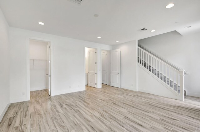 unfurnished living room with light wood-type flooring