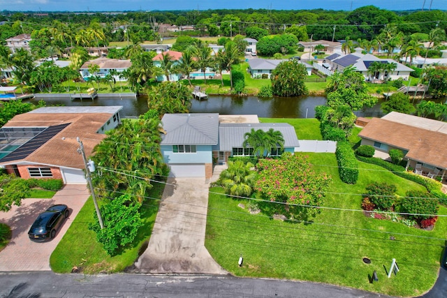 birds eye view of property featuring a water view and a residential view