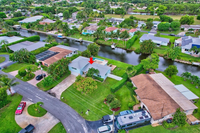 bird's eye view featuring a residential view and a water view