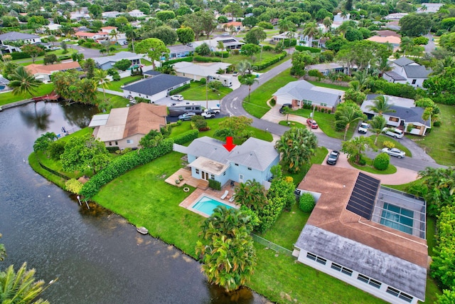birds eye view of property featuring a water view and a residential view