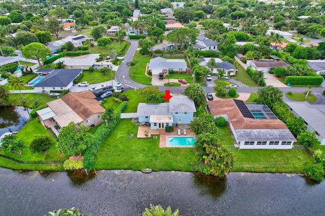 drone / aerial view featuring a water view and a residential view