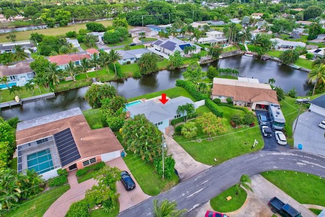 bird's eye view featuring a residential view and a water view