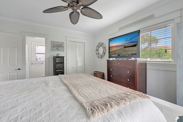 bedroom featuring a closet, connected bathroom, a ceiling fan, and crown molding