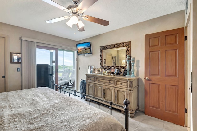 bedroom featuring light tile patterned flooring, access to outside, a textured ceiling, and ceiling fan