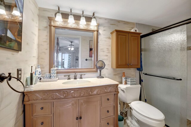 bedroom with light tile patterned flooring, connected bathroom, and ceiling fan