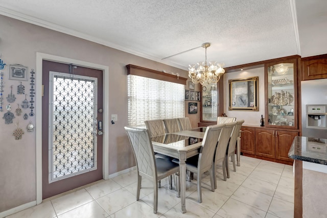 tiled dining space with a chandelier and a textured ceiling