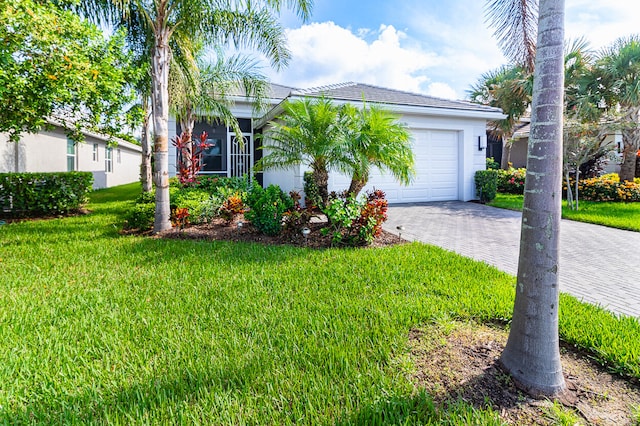 view of front of home featuring a garage and a front yard