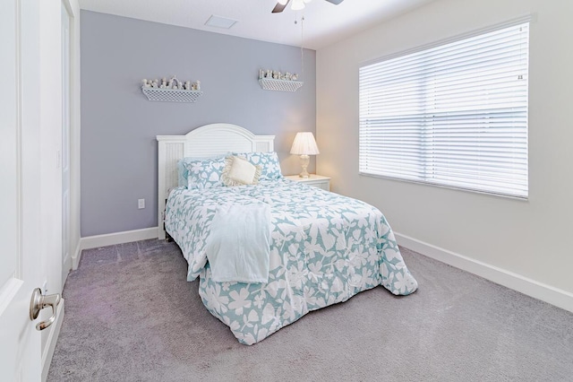 bedroom featuring ceiling fan, carpet flooring, and baseboards