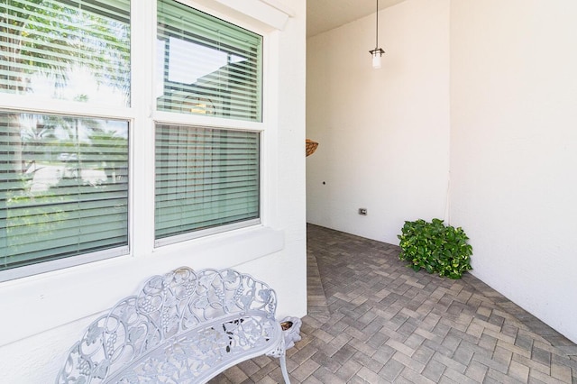 property entrance with stucco siding