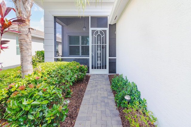 doorway to property with stucco siding