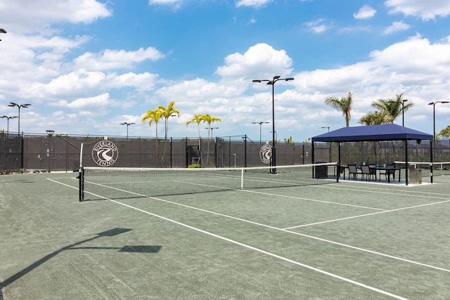 view of tennis court with fence