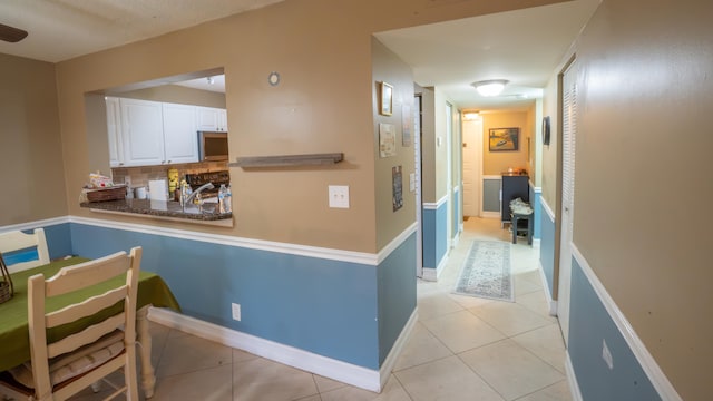 interior space with light tile patterned floors