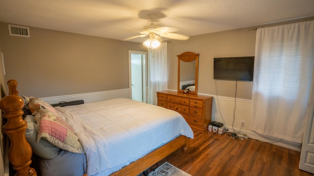 bedroom featuring ceiling fan and dark hardwood / wood-style floors