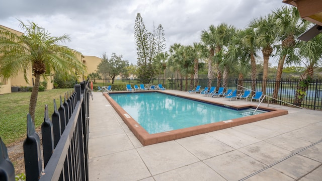 view of swimming pool featuring a patio area