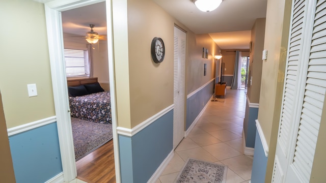 hall with light tile patterned flooring