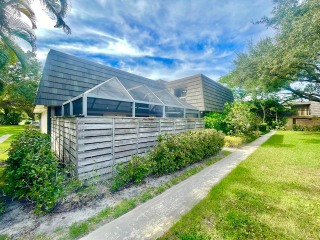 view of home's exterior with a yard