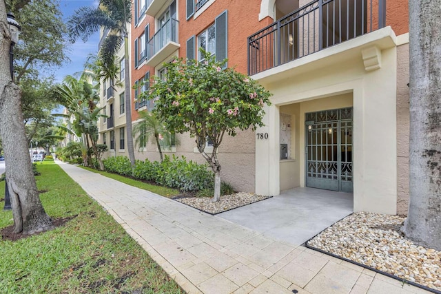 doorway to property featuring a balcony