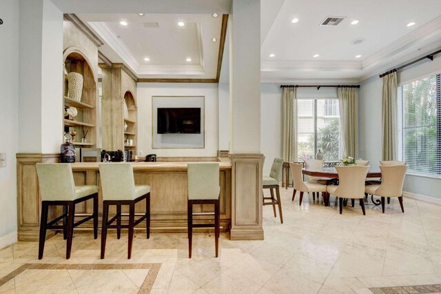 kitchen featuring built in shelves, plenty of natural light, and light tile patterned floors