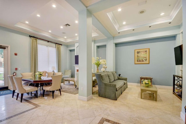 tiled dining space with a tray ceiling