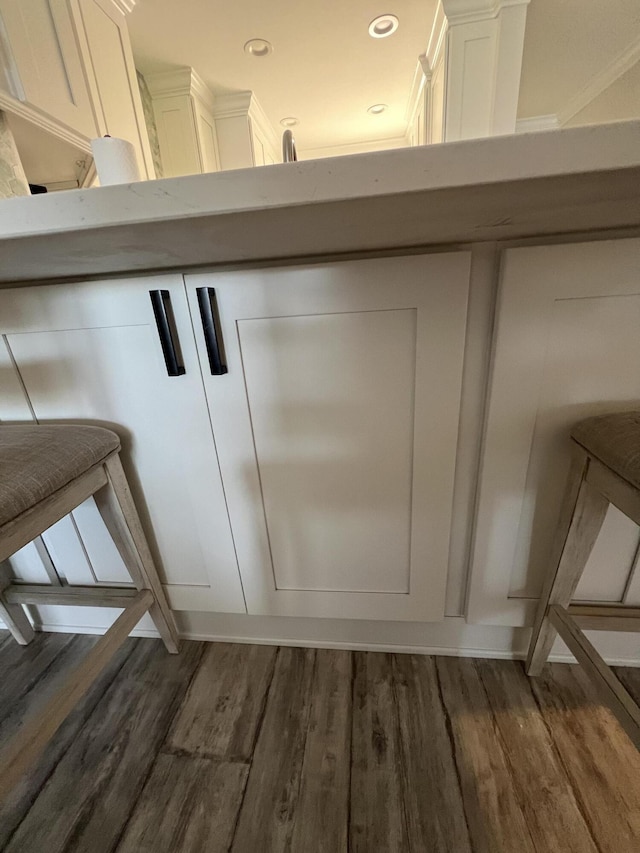 interior details featuring wood finished floors and recessed lighting