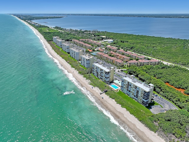 aerial view with a water view and a view of the beach