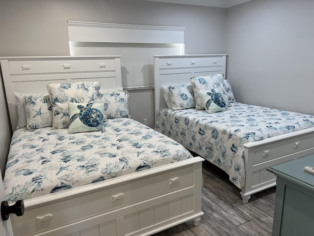 bedroom featuring dark wood-style flooring