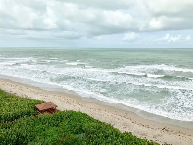 view of water feature with a beach view