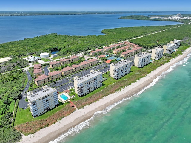 bird's eye view with a view of the beach and a water view