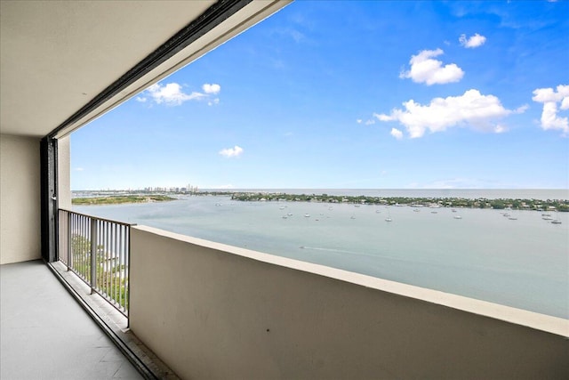 balcony featuring a water view