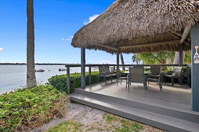 wooden terrace with a gazebo and a water view