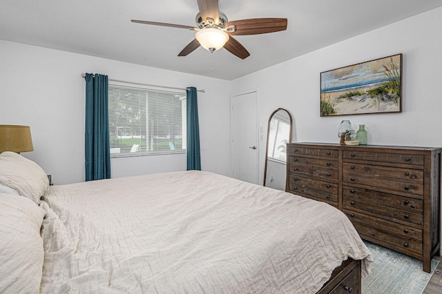 bedroom featuring multiple windows, ceiling fan, and light hardwood / wood-style floors