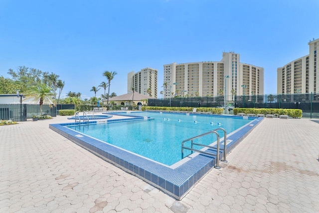 view of swimming pool featuring a patio area