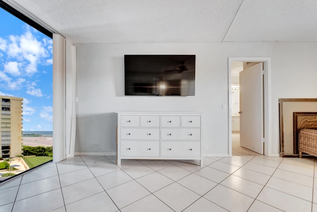 unfurnished living room with light tile patterned floors