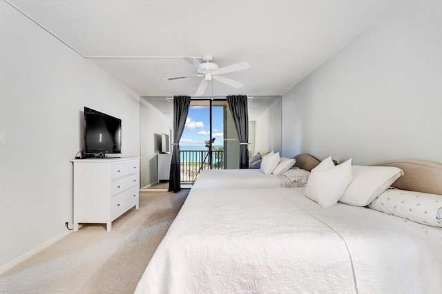 bedroom featuring access to exterior, ceiling fan, and light colored carpet