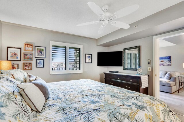 bedroom featuring ceiling fan and light hardwood / wood-style flooring