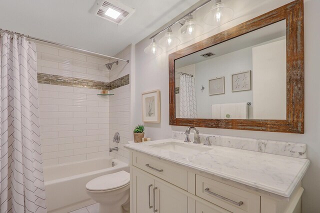 full bathroom with shower / bath combo, vanity, toilet, and tile patterned flooring