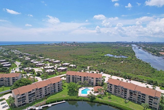 birds eye view of property with a water view