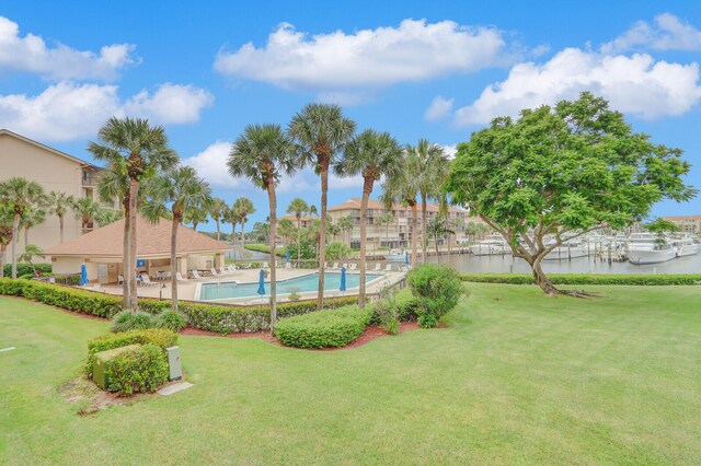 view of yard with a patio and a community pool