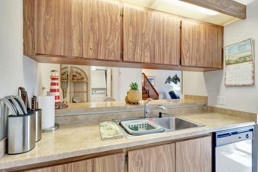 kitchen with white dishwasher and sink