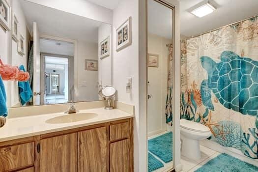 bathroom featuring tile patterned floors, toilet, and vanity