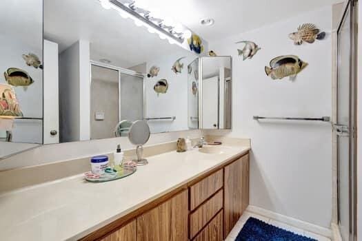 bathroom with vanity and an enclosed shower